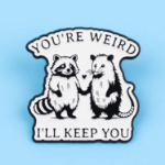 Przypinka you’re weird i’ll keep you pin szop opos emaliowany