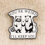 Przypinka you’re weird i’ll keep you pin szop opos emaliowany