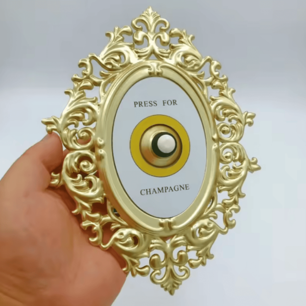 Dzwonek „Press for Champagne” – złota dekoracja vintage do domu